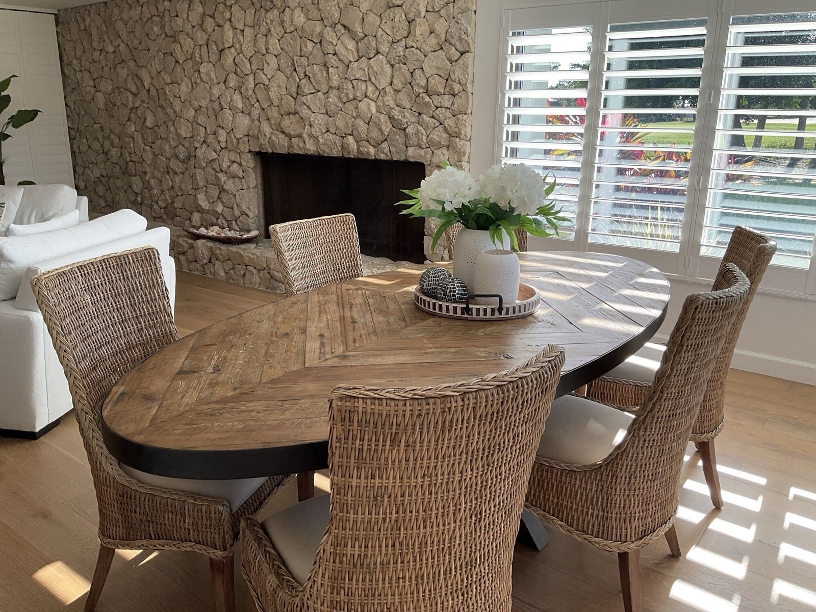 Separate dining room with a round wooden table