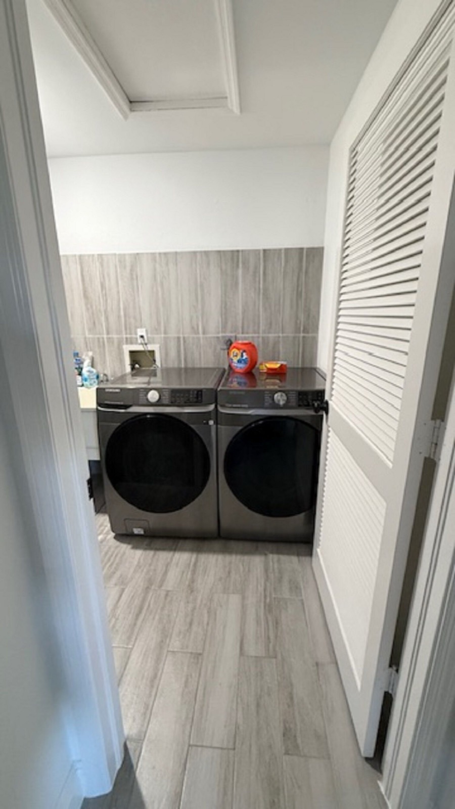 Laundry room with washing machine and dryer